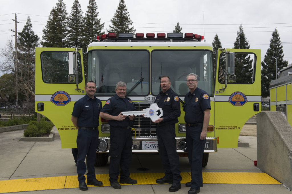 Chief Brian Marshall handing over new engine to Ventura County
