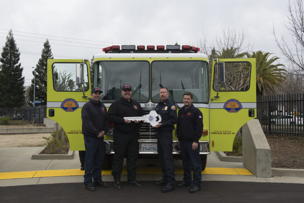 Chief Brian Marshall handing over new engine to Fountain Valley Fire Department