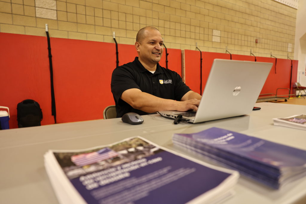A Cal OES representative sitting at a Disaster Recovery Center in Nevada County.