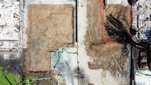 LA fire debris removal progress showing multiple properties cleared of fire ash and debris.