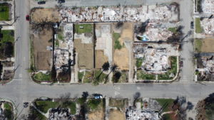 LA fire debris removal progress showing multiple properties cleared of fire ash and debris.