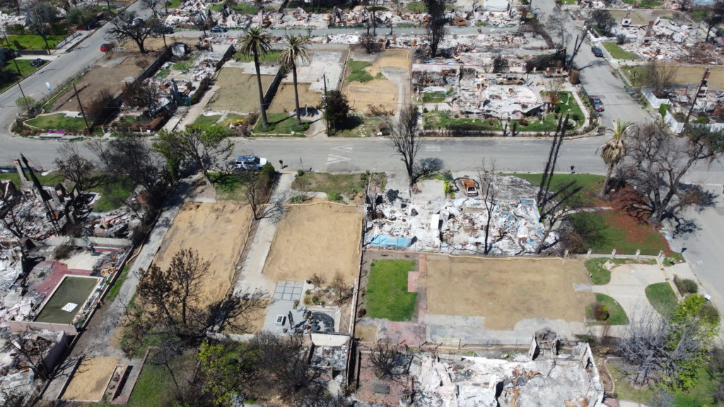 LA fire debris removal progress showing multiple properties cleared of fire ash and debris.