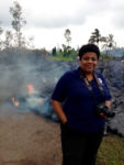 Kelly Hudson stand in front of Pu'u O'o lava flow