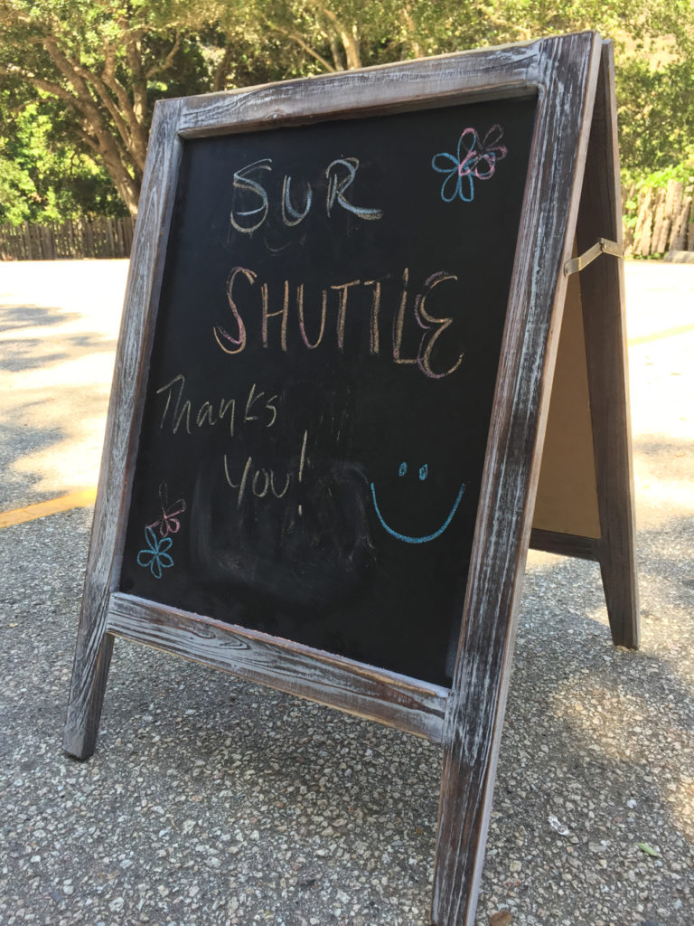 Shuttle Service Sign at Nepenthe Restaurant for travel around Pfeiffer Canyon Bridge Reconstruction Project, Big Sur
