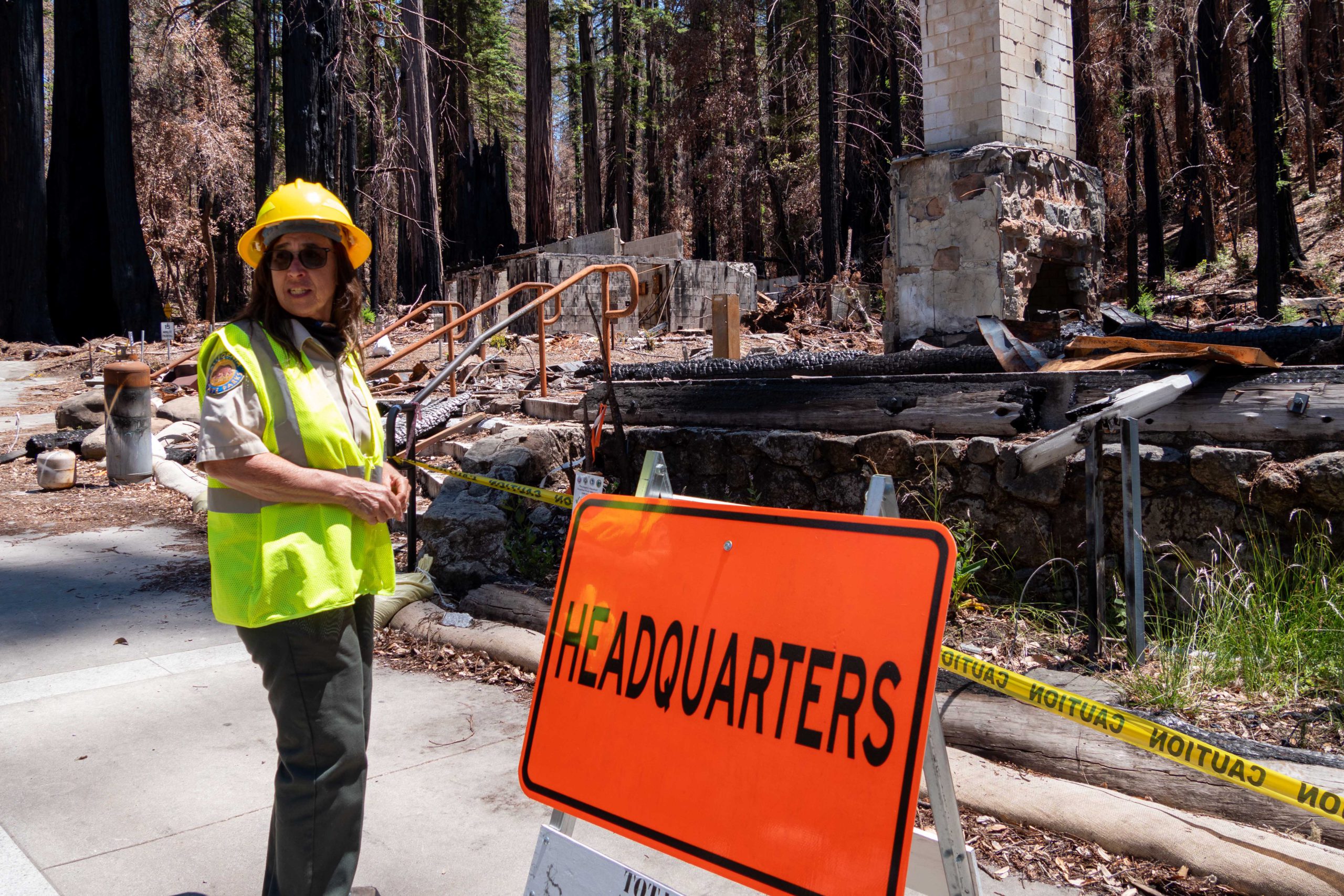 Joanne Kerbavaz stands in front of park HQ rubble