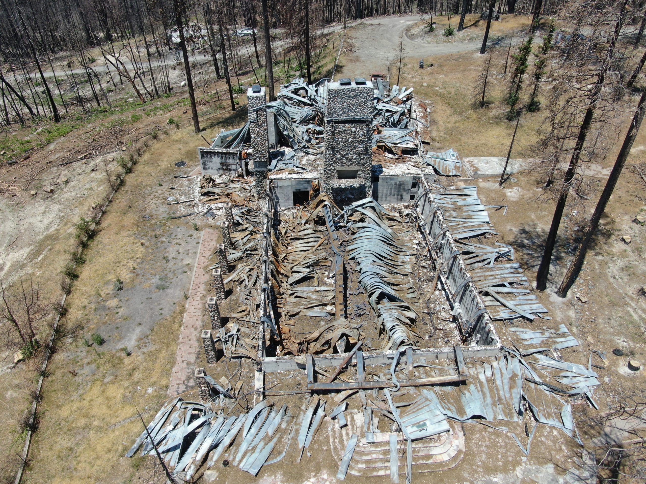 Burned structural debris at Camp Okizu