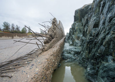 The side of the Oroville Dam spilllway wall is badly damaged, exposing its rebar, March 4, 2017.