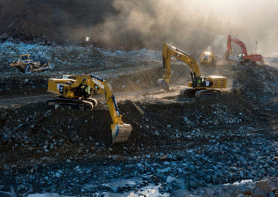 Heavy equipment work continues just after daybreak on March 1, 2017 to remove the huge debris field in the diversion pool at the base of the damaged Oroville Dam spillway.